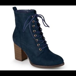 Navy blue ankle lace-up boots.